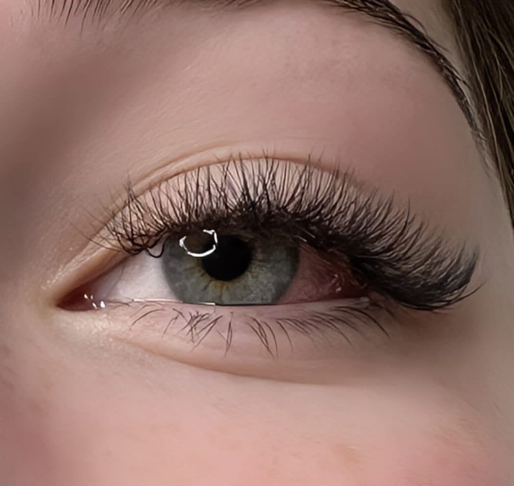 Classic lash extensions on a green eye, close-up by 902 Beauty Bar, Dartmouth NS