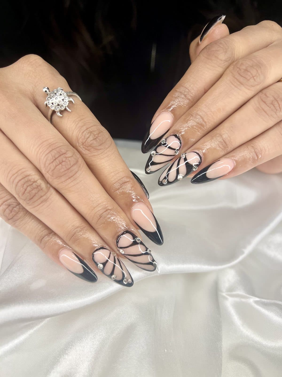 Black French tip nails with abstract black line art by 902 Beauty Bar, Dartmouth NS