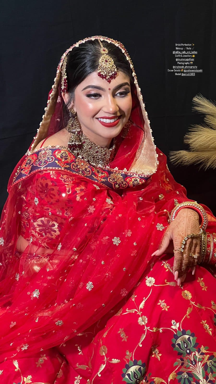 Bridal makeup with red lehenga, dupatta and gold jewellery in studio by 902 Beauty Bar, Dartmouth NS