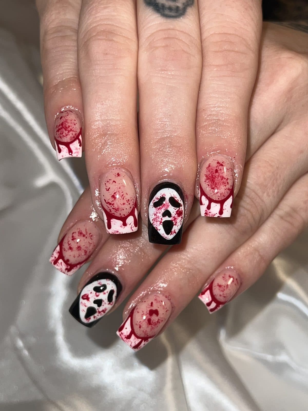 Red and white candy cane holiday nail art with black accents by 902 Beauty Bar, Dartmouth NS