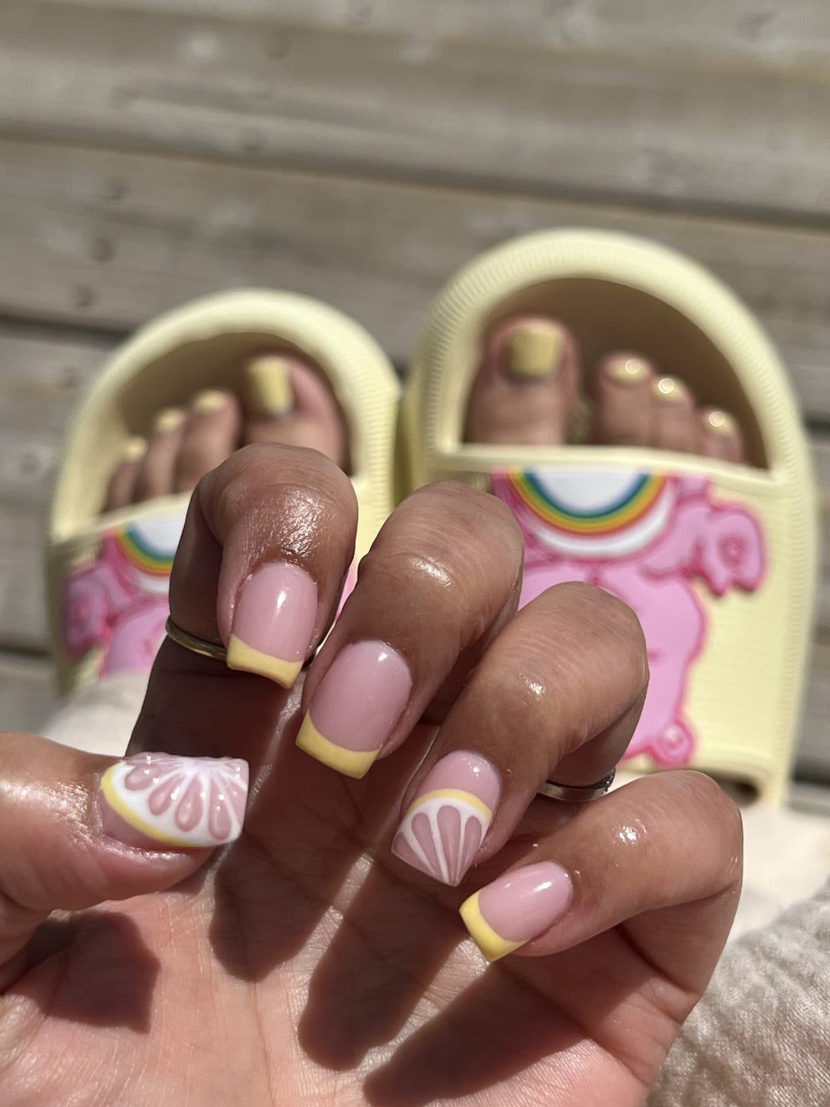 Pedicure with yellow French tips and a playful chick design by 902 Beauty Bar, Dartmouth NS