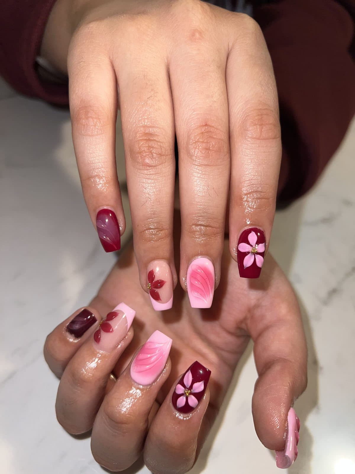 Pink floral almond nails with burgundy accent nails by 902 Beauty Bar, Dartmouth NS