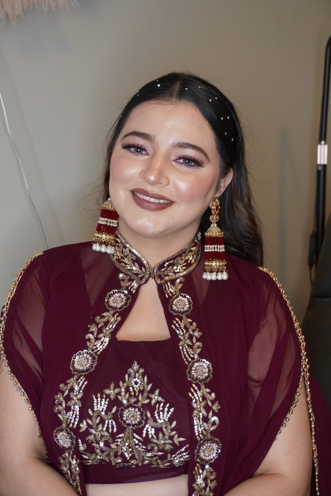 Party makeup with a maroon outfit and gold jewellery by 902 Beauty Bar, Dartmouth NS