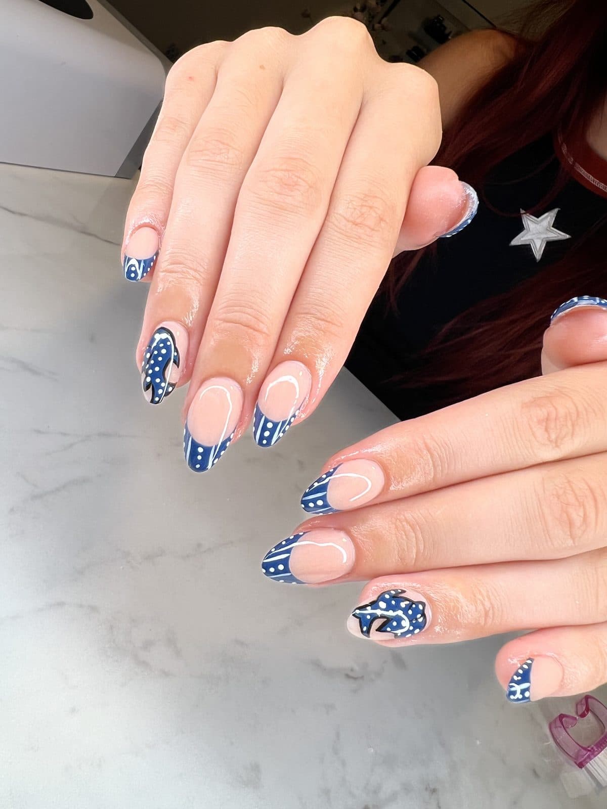Navy and white patterned nail art with white star accents by 902 Beauty Bar, Dartmouth NS
