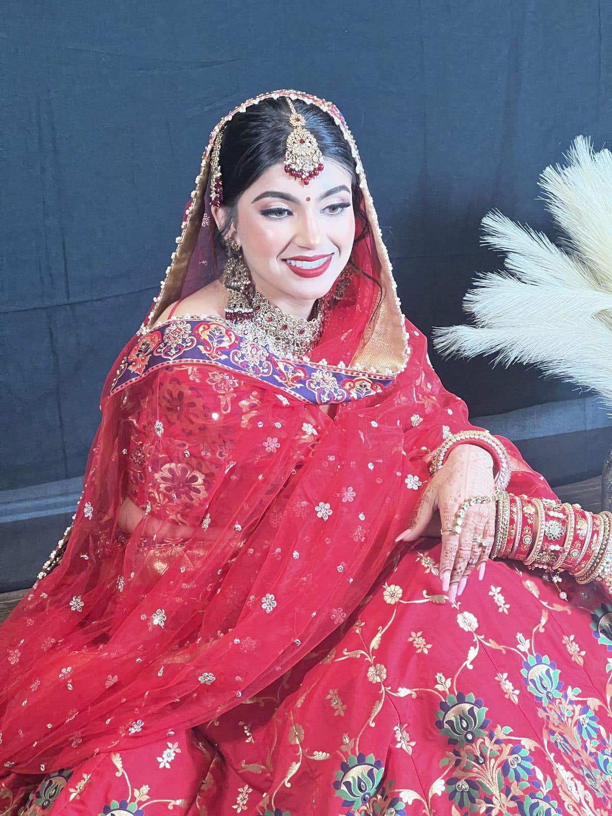 Bridal makeup in red and gold with traditional jewellery by 902 Beauty Bar, Dartmouth NS
